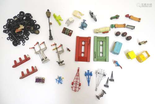 Toys: A quantity of die cast scale model spare parts and accessories to include wheels, tyres, two