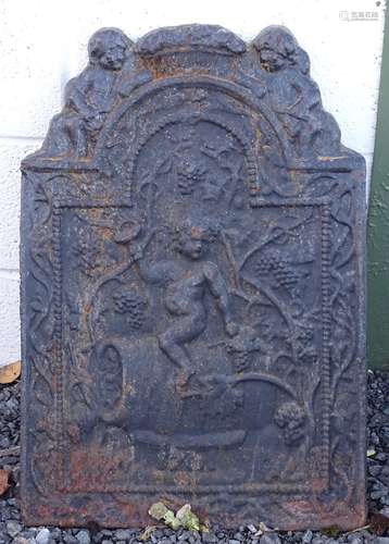 Garden & Architectural, Salvage: an 18thC cast iron fire back, decorated with depiction of a Bacchus