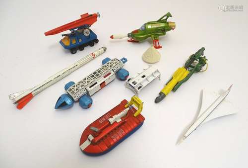 Toys: A quantity of assorted die cast dinky vehicles / rockets comprising Dinky Toys Eagle Freighter