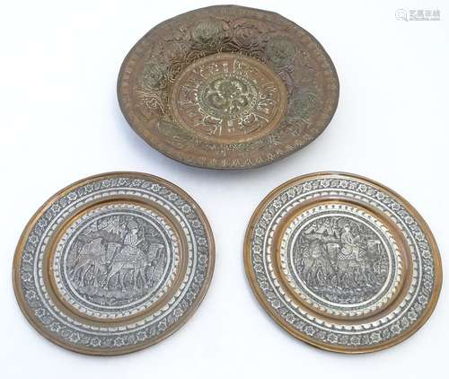 An embossed decorative metal charger with central roundel depicting an Oriental style dragon,