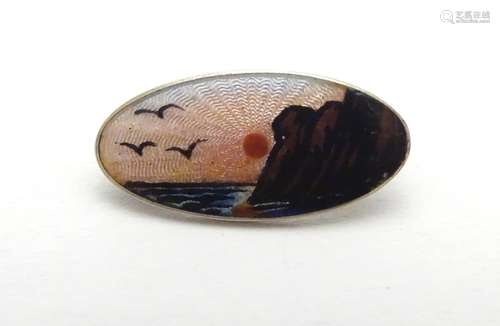 Scandinavian jewellery : A silver brooch of oval form decorated with guilloche enamel sunset