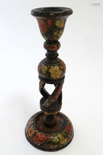 A 20thC Kashmiri candlestick with open twist column and hand painted floral decoration. Approx. 9