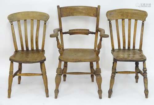 Three 19thC Windsor chairs. An Oxford bar back with swept arms and an elm seat, raised on turned