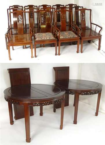 An early 20thC set of twelve dining chairs together with a matching dining table. The Chinese