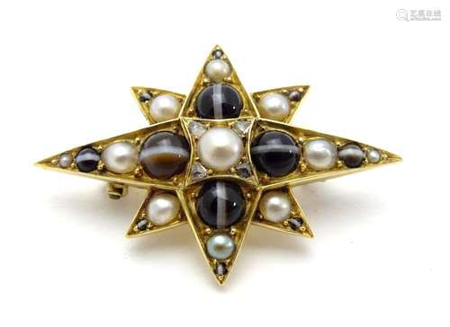 A yellow metal brooch of star form set with banded agate, rose-cut diamonds and half pearls. 1 1/