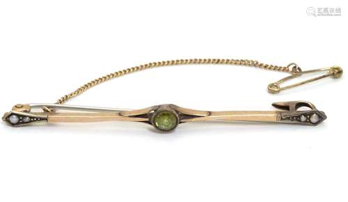 A 9ct gold bar broch set with peridot and seed pearls 2 1/2