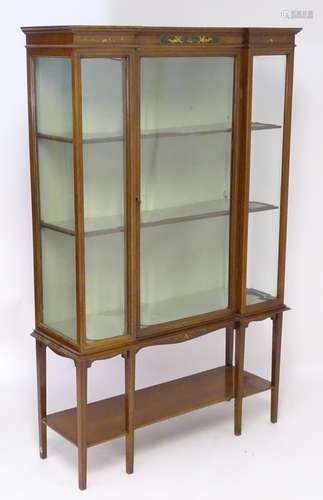 An early / mid 20thC inverted breakfront glazed display cabinet, having a moulded cornice above a