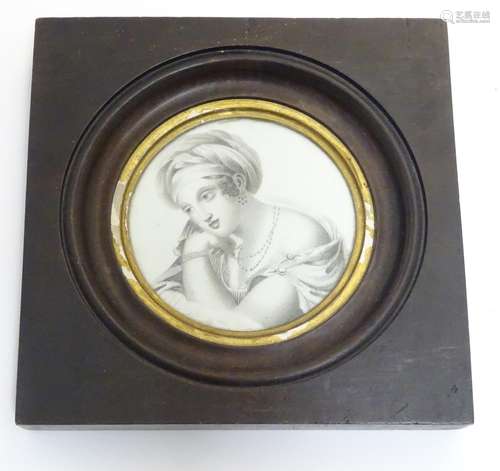 A 19thC Continental circular portrait miniature depicting a portrait of a lady wearing a draping