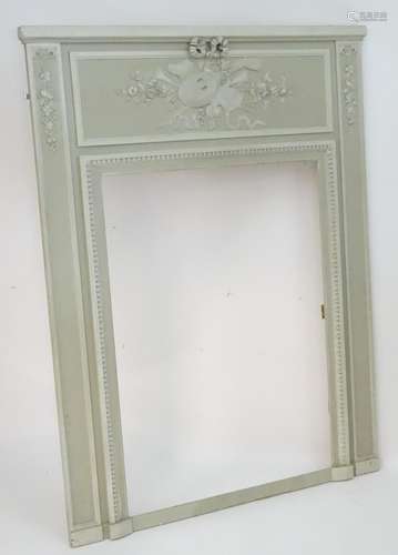 A 20thC overmantle mirror surround with a moulded cornice above a carved cornucopia flanked by