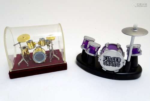 Toys: Two sets of finger drums, one drum kit within a domed case, the other a novelty desktop