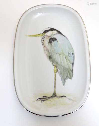 A German Arzberg plate / charger of ovoid form with hand painted heron bird decoration. Marked under