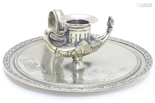 A 19thC silver plate chamber stick with Greek key decoration and central candle holder formed as a