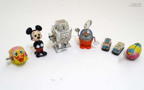 Toys: A quantity of 20thC wind up / clockwork toys to include Moon Stroller Robot, Mickey Mouse, tin