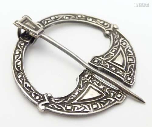 Scottish Silver : A Scottish penannular brooch with celtic decoration. Hallmarked Glasgow 1947 maker