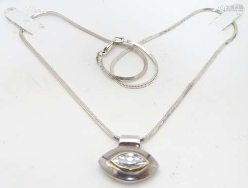 A silver pendant on chain, the lozenge shaped pendant set with a similarly contoured single white