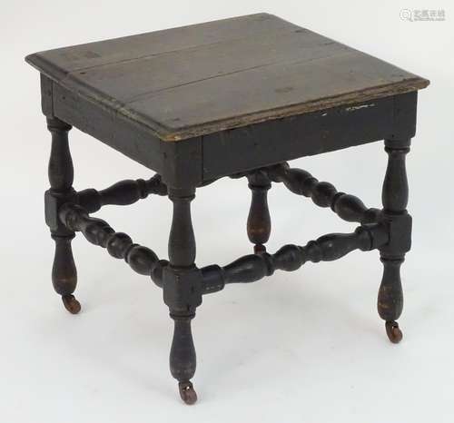 A 19thC oak stool on turned legs united by a box stretcher, the turned feet terminating in porcelain