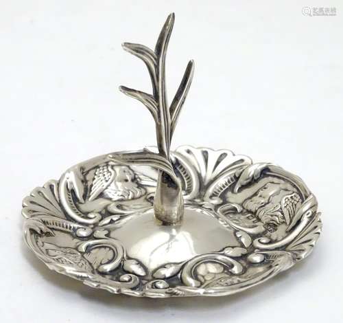 A silver ring tree with embossed scroll and angel decoration Hallmarked Birmingham 1905 maker Sydney