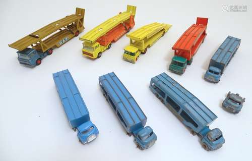 Toys: A large quantity of Lesney / Matchbox die cast scale model car transporters comprising Guy