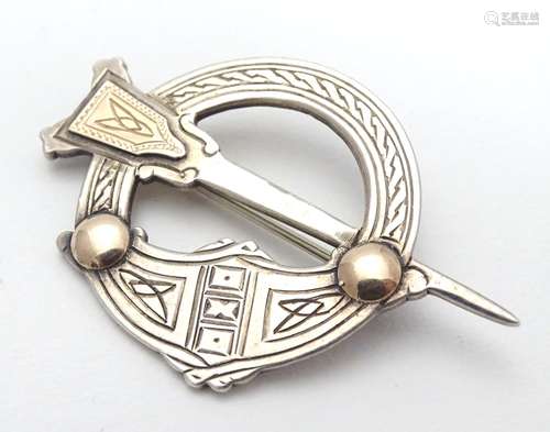 An Irish silver Tara kilt-pin of Pseudo Penannular form with gilt detail. Hallmarked Dublin 1960