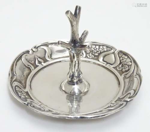 An Art nouveau silver ring tree with embossed decoration hallmarked Birmingham 1902 maker Henry