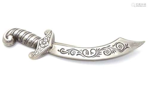 A silver brooch formed a scimitar sword marked Sterling Lang 3