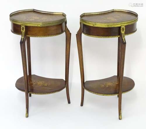 A pair of early 20thC side tables with pierced gilt surrounds and marquetry inlaid tops. The