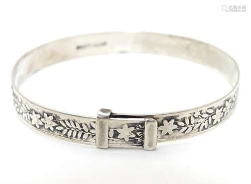 A silver bracelet of bangle form marked W S Ltd Silver. Please Note - we do not make reference to