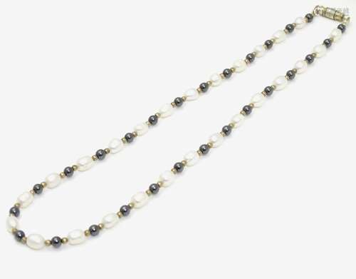 A necklace of pearl and iolite beads. Approx. 16