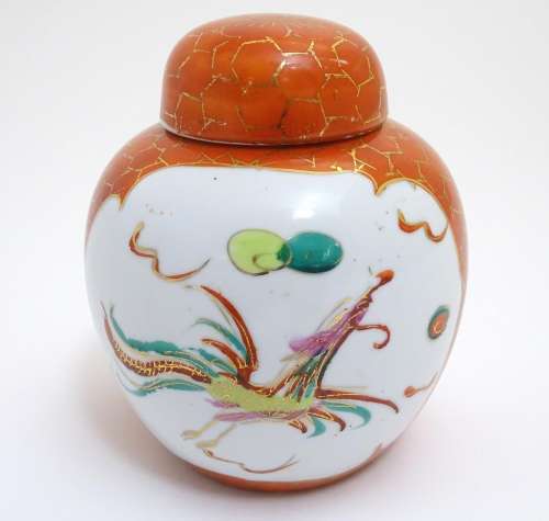 An Oriental ginger jar with hand painted decoration with lobed panels depicting a stylised dragon