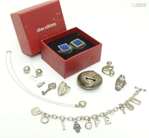 Assorted items including a silver bracelet, pendant etc a silver baby's rattle section titled '