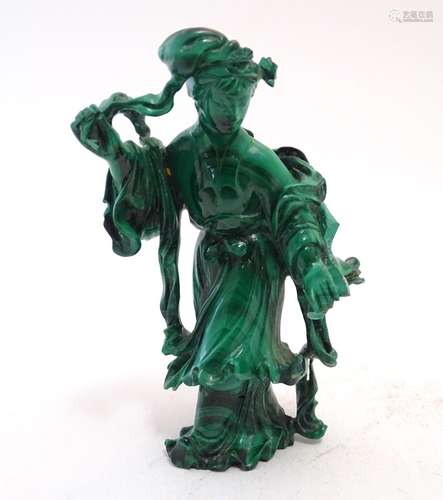 An Oriental malachite carving modelled as a woman in a flowing dress. Approx. 3 1/3