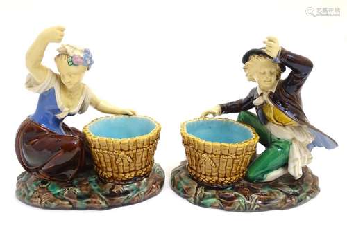 A pair of Minton style majolica figures after designs by Albert Carrier Belleuse. A washer woman and