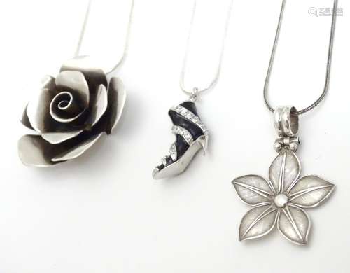 Three various white metal pendants and chains. Please Note - we do not make reference to the