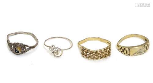 4 assorted rings to include 2 9ct gold examples. Please Note - we do not make reference to the