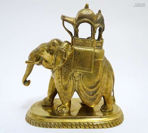 A 20thC brass elephant carrying a decorated howdah. Approx. 6