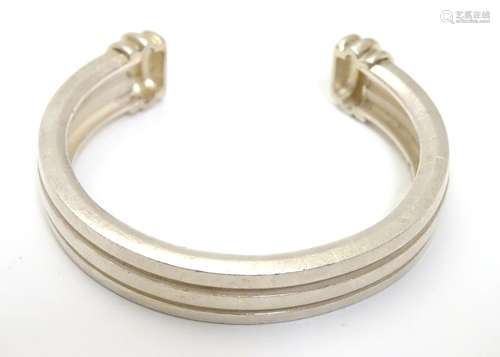 A silver cuff bangle marked 'Tiffany &Co. © 1995 925'. Boxed. Please Note - we do not make reference