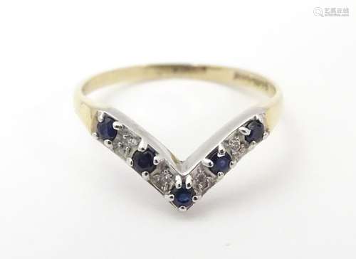 A 9ct gold ring set with diamonds and blue spinel in a wishbone setting. Ring size approx O Please