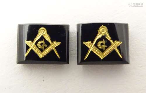 Two onyx stones set with gilt masonic symbols. Approx 1/4