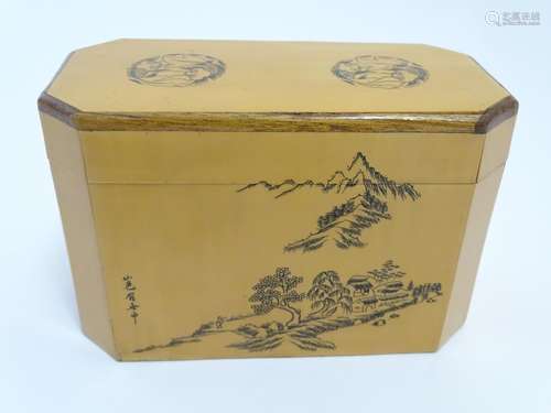 A Chinese blonde wood two sectional caddy decorated with a mountainous landscape scene, cherry