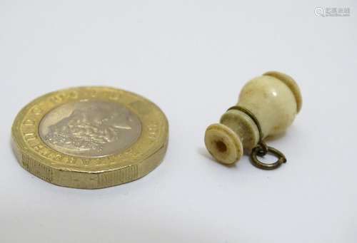 A Victorian carved bone stanhope displaying a religious verse within. Approx. 3/4