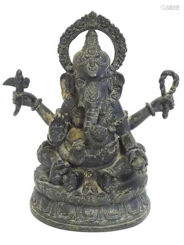 A 19thC bronze model of the Hindu deity Ganesh with attributes including an open palm, an axe, a