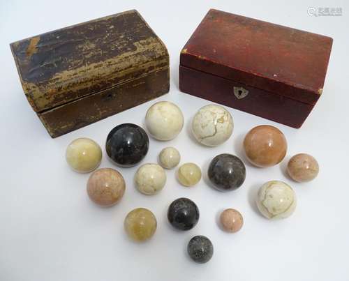 A quantity of polished agate spheres / balls of various sizes and colours, contained within two late