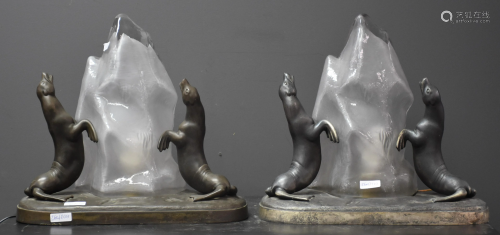 Pair of art deco lamps in regulates, sea lions