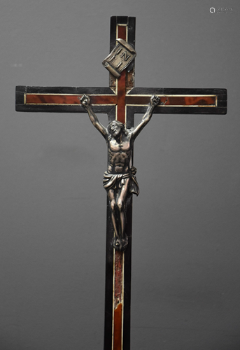 Christ in silver on his cross in tortoiseshell veneer.