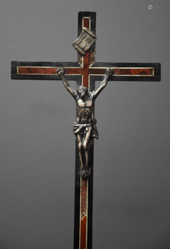 Christ in silver on his cross in tortoiseshell veneer.