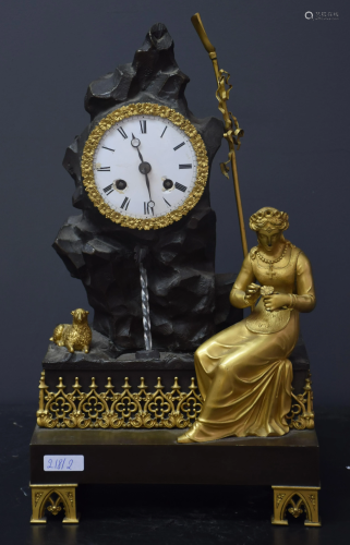Gilt and patinated bronze clock. Romantic subject at