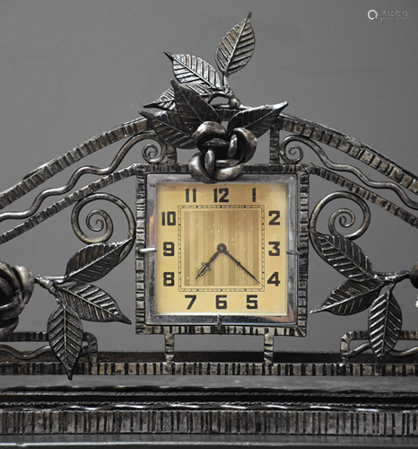 Wrought iron art deco clock. Ht 28 cm. Length 64 cm.