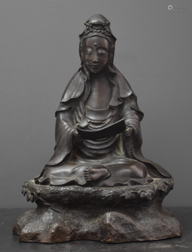 Asian bronze deity reading. Ht 34 cm.