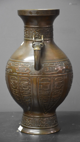 Bronze vase, animal mouth handles. China around 1900.
