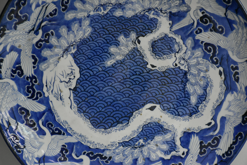 Large Japanese porcelain dish decorated with swans.